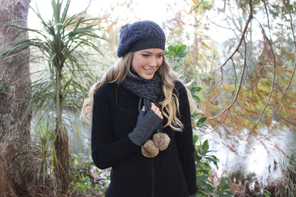 CABLE SCARF WITH RABBIT FUR POMPOMS
