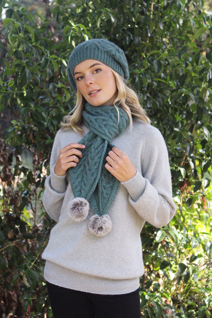 CABLE SCARF WITH RABBIT FUR POMPOMS